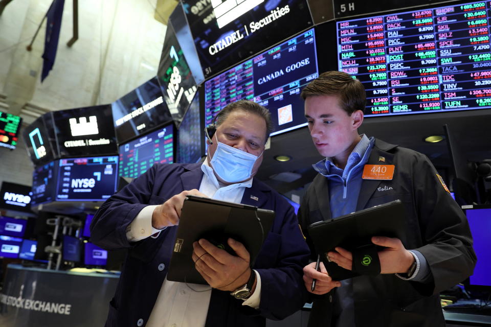 Traders work on the floor of the New York Stock Exchange (NYSE) in New York City, U.S., March 21, 2022.  REUTERS/Brendan McDermid