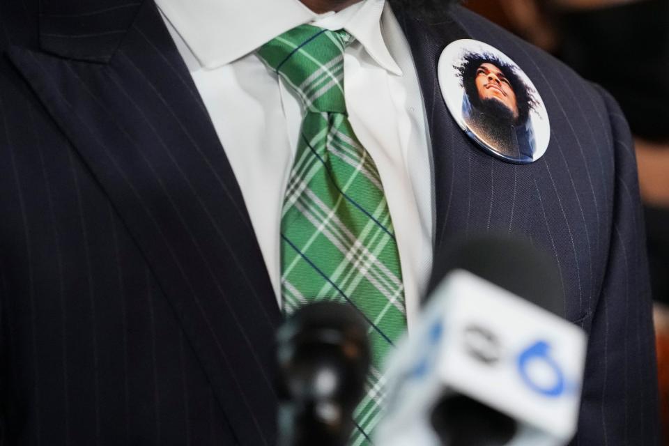 Attorney Sean Walton wears a button with the face of Casey Goodson Jr. while speaking during a news conference Thursday.