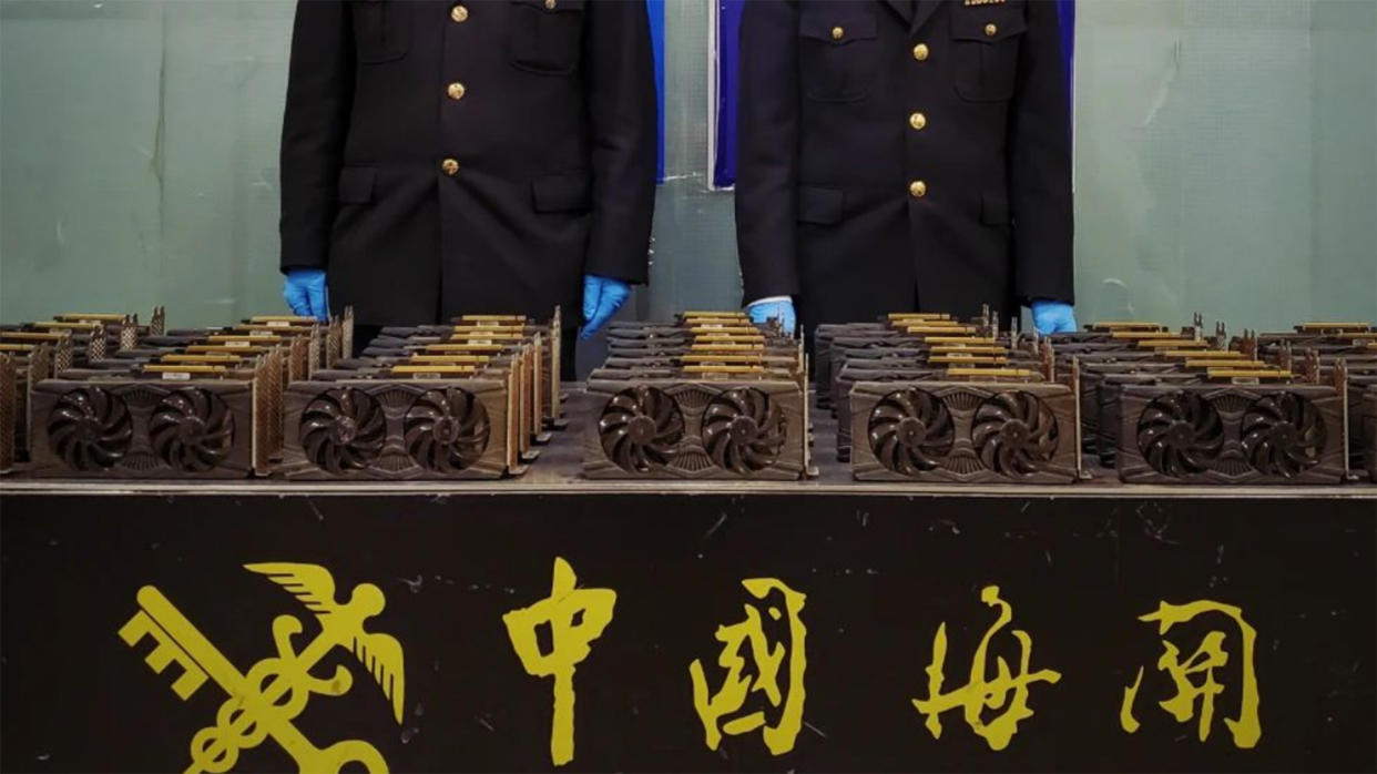  An image showing Chinese custom officials with a haul of RX 580 graphics cards. 