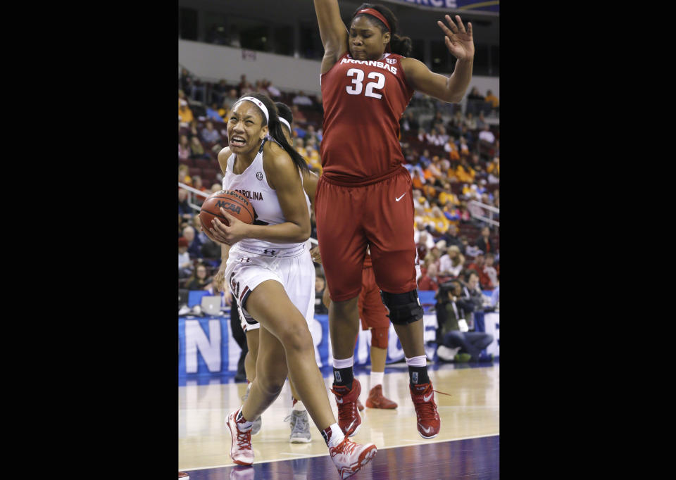 FILE - In this Friday, March 6, 2015 file photo, Arkansas' Khadijah West, right, defends against South Carolina's A'ja Wilson in the second half of an NCAA college basketball game in the quarterfinals of the Southeastern Conference tournament, in North Little Rock, Ark. Las Vegas Aces star A'ja Wilson is checking in periodically from the FIBA Women's Basketball World Cup. (AP Photo/Danny Johnston, File)