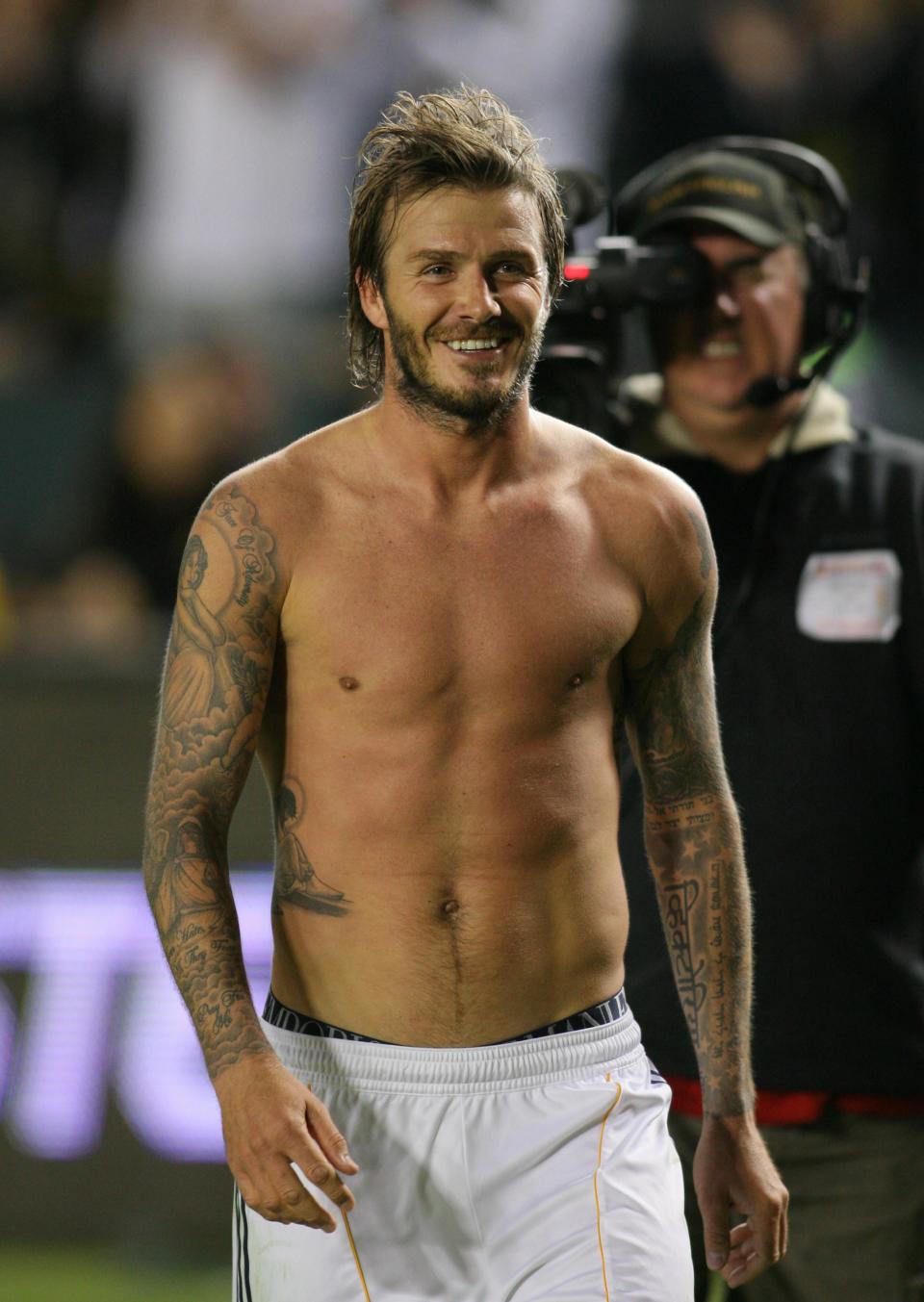 CARSON, CA - NOVEMBER 07: David Beckham #23 of the Los Angeles Galaxy smiles on his way to the locker room after the Galaxy defeated Seattle Sounders FC in the MLS Western Conference Semifinal match second leg at The Home Depot Center on November 7, 2010 in Carson, California. The Galaxy defeated Sounders FC 2-1. (Photo by Victor Decolongon/Getty Images)