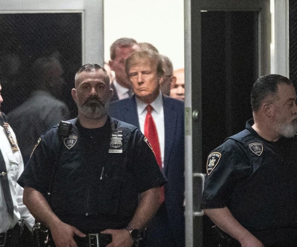 Former President Donald Trump arrives in court for his arraignment on Tuesday in New York.
