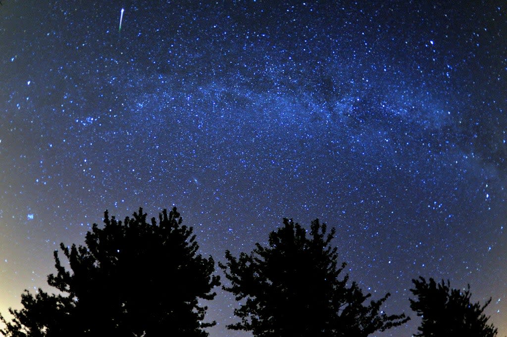 Meteor seen during the Perseids meteor shower over the Cotswold Water Park near Cirencester, Gloucestershire (Tim Ireland/PA) (PA Archive)