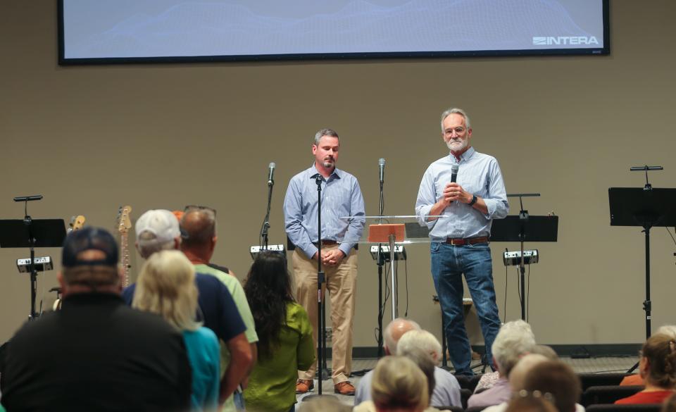 John Cochran, a representative from Indiana’s Economic Development Corp., and  Jack Wittman, vice president of eastern water for INTERA Inc., listen to residents explain their concerns about the company's initial testing of the aquifer in Lafayette, on Thursday, Sept. 28, 2023, at Church Alive, in Lafayette.