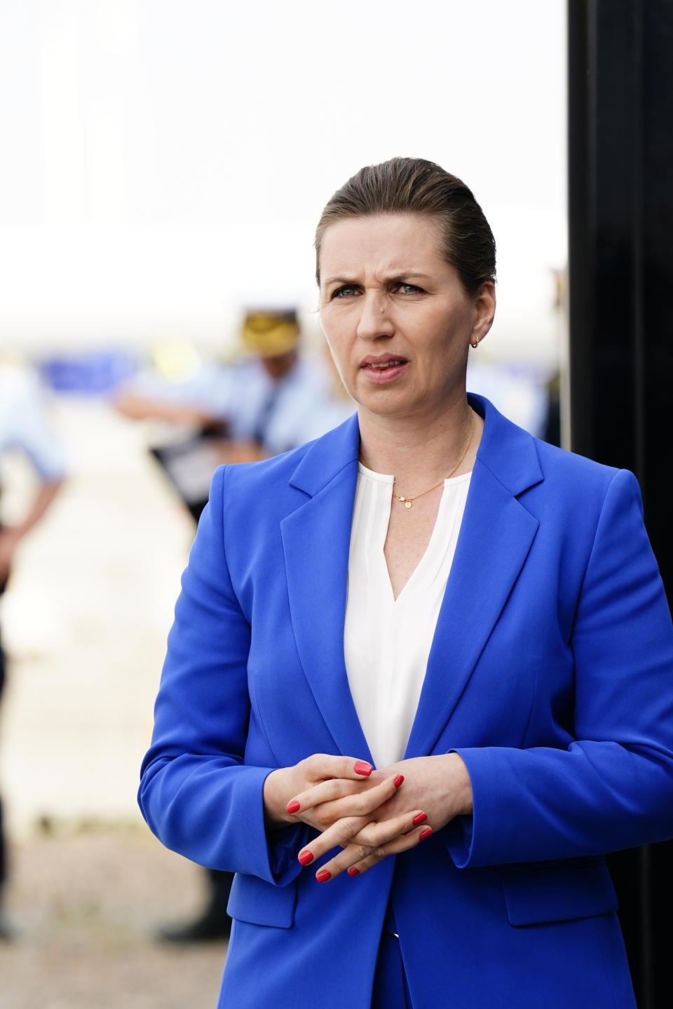 Danish prime minister Mette Frederiksen arrives at a press conference at the Port of Esbjerg, Denmark, on Wednesday, May 18, 2022. Four European Union countries plan to build North Sea wind farms capable of producing at least 150 gigawatts of energy by 2050 to help cut carbon emissions that cause climate change, Danish media reported Wednesday. Under the plan, wind turbines would be raised off the coasts of Belgium, the Netherlands, Germany and Denmark, daily Danish newspaper Jyllands-Posten said. (Bo Amstrup/Ritzau Scanpix via AP)