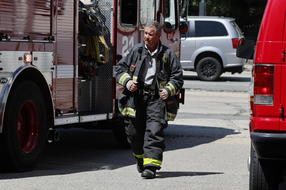 Lt. Chris Stevens wears his turnout gear as Engine 21 backs into the firehouse, Thursday, Aug. 24, 2023, in the Dorchester neighborhood of Boston. (AP Photo/Michael Dwyer)