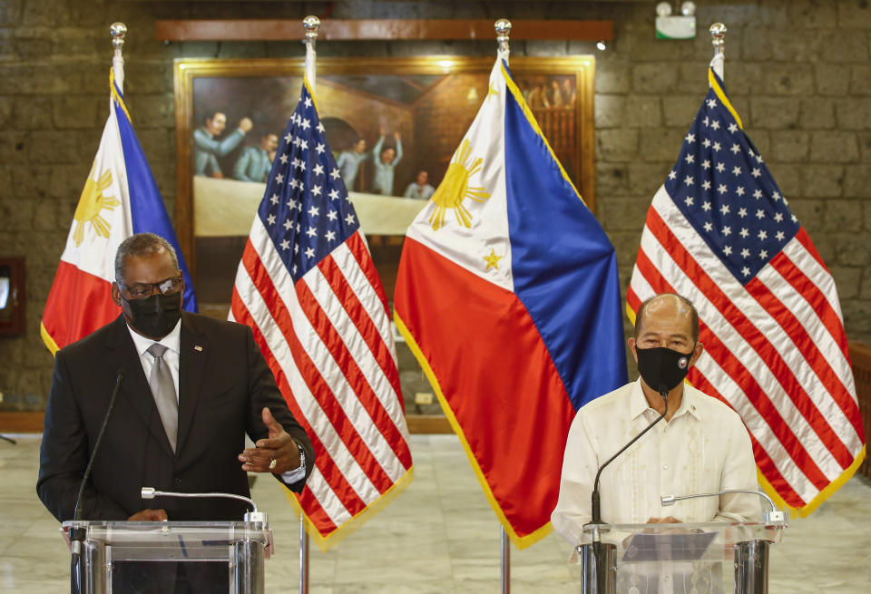 United States Defense Secretary Lloyd Austin, left, and Philippines Defense Secretary Delfin Lorenzana hold a press conference after a bilateral meeting at Camp Aguinaldo military camp in Quezon City, Metro Manila, Philippines Friday, July 30, 2021. Austin is visiting Manila to hold talks with Philippine officials to boost defense ties and possibly discuss the The Visiting Forces Agreement between the US and Philippines. (Rolex dela Pena/Pool Photo via AP)