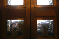 FILE - In this Jan. 6, 2021, file photo, U.S. Capitol Police try to hold back rioters outside the east doors to the House side of the U.S. Capitol, Wednesday, Jan 6, 2021. (AP Photo/Andrew Harnik)