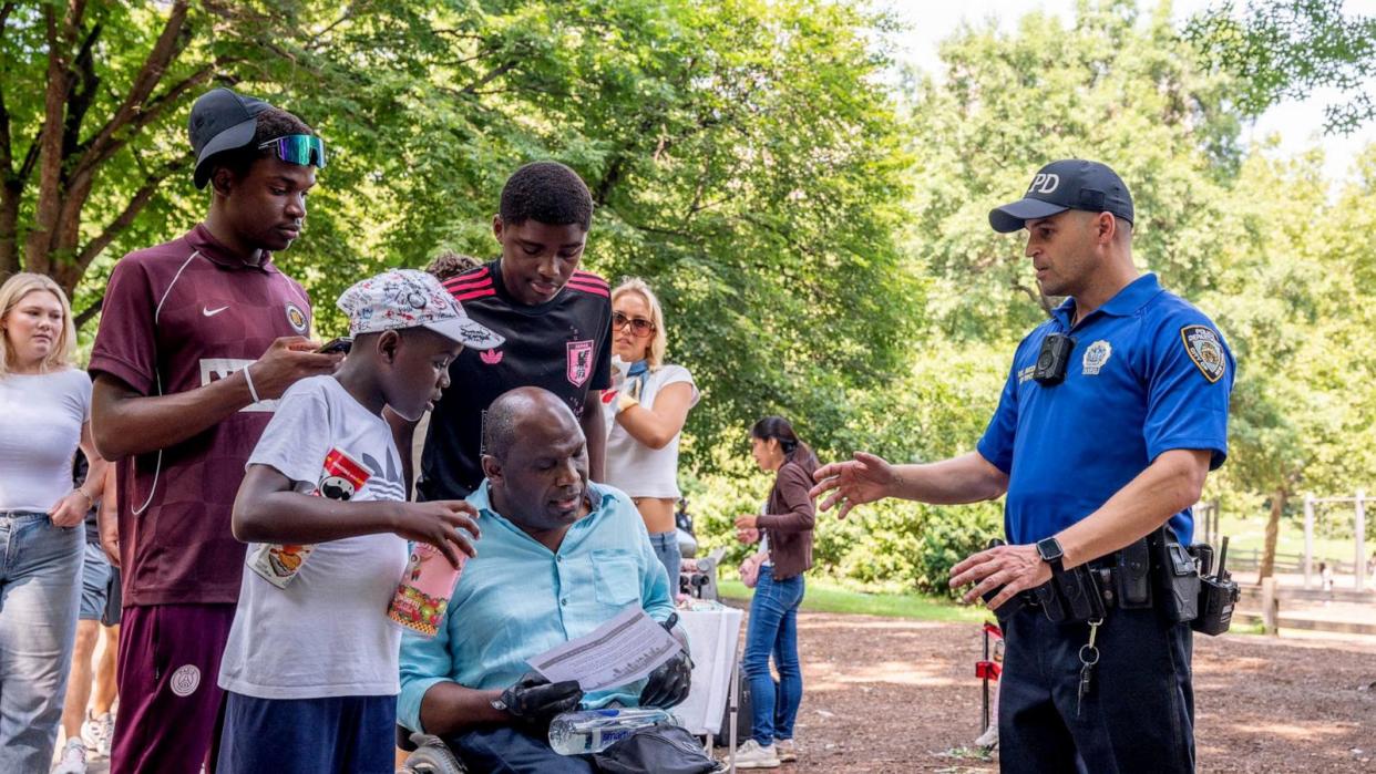 PHOTO: An unidentified NYPD crime prevention officer advises Central Park visitors on Aug. 15, 2024, on how to protect themselves from crime. (NYPD)