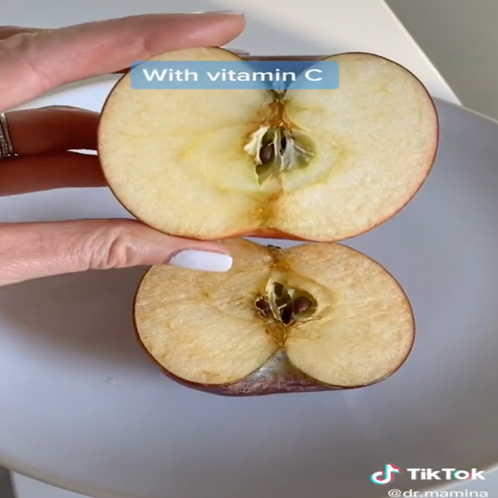 the doctor showing a closeup of the vitamin C apple