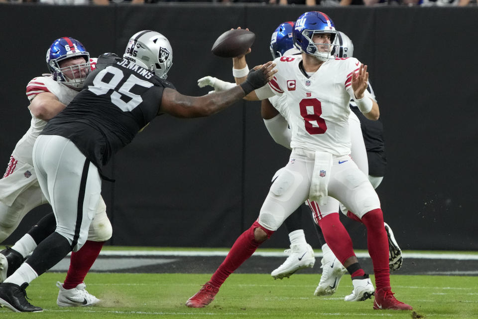 New York Giants quarterback Daniel Jones (8) throws against the Las Vegas Raiders during the first half of an NFL football game, Sunday, Nov. 5, 2023, in Las Vegas. (AP Photo/Rick Scuteri)