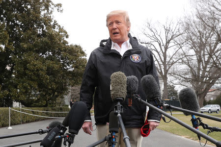 FILE PHOTO: U.S. President Donald Trump talks to reporters as he departs to visit storm-hit areas of Alabama from the White House in Washington, U.S., March 8, 2019. REUTERS/Jonathan Ernst