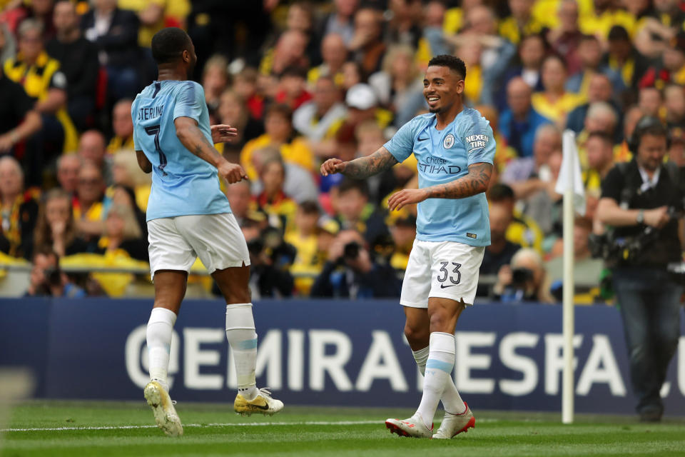 Gabriel Jesus of Manchester City celebrates with teammate Raheem Sterling after scoring his team's second goal during the FA Cup Final match between Manchester City and Watford at Wembley Stadium.