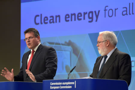 European Commission Vice-President Maros Sefcovic (L) and Commissioner Miguel Arias Canete hold a news conference on Clean Energy package in Brussels, Belgium November 30, 2016. REUTERS/Eric Vidal