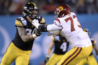 Iowa defensive end A.J. Epenesa, left, is blocked by Southern California offensive tackle Austin Jackson (73) during the first half of the Holiday Bowl NCAA college football game Friday, Dec. 27, 2019, in San Diego. (AP Photo/Orlando Ramirez)
