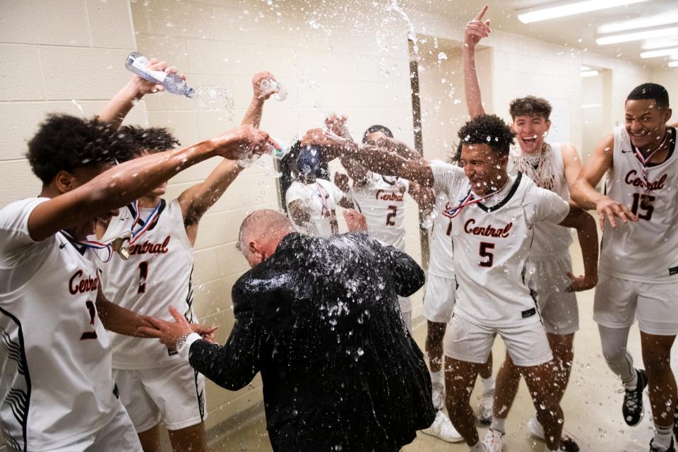 Central York players including No. 5 Nasir Ruppert douse head coach Jeff Hoke with water as they celebrate in the locker room after winning the YAIAA boys' basketball championship against Friday, Feb. 16, 2024, at Red Lion Area High School. The Panthers defeated York Suburban, 63-45.