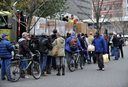 People line up to get a bag of dry ice from Con Edison in Union Square in New York as the city recovers from the effects of Hurricane Sandy