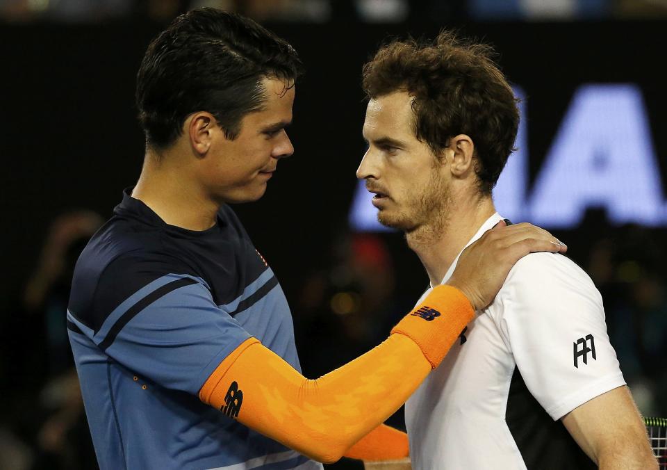 Raonic looks like he's the one consoling Murray - instead of the other way around – after the Canadian's adductor injury scuttled his opportunity to get to his first Grand Slam final. (REUTERS/Tyrone Siu)