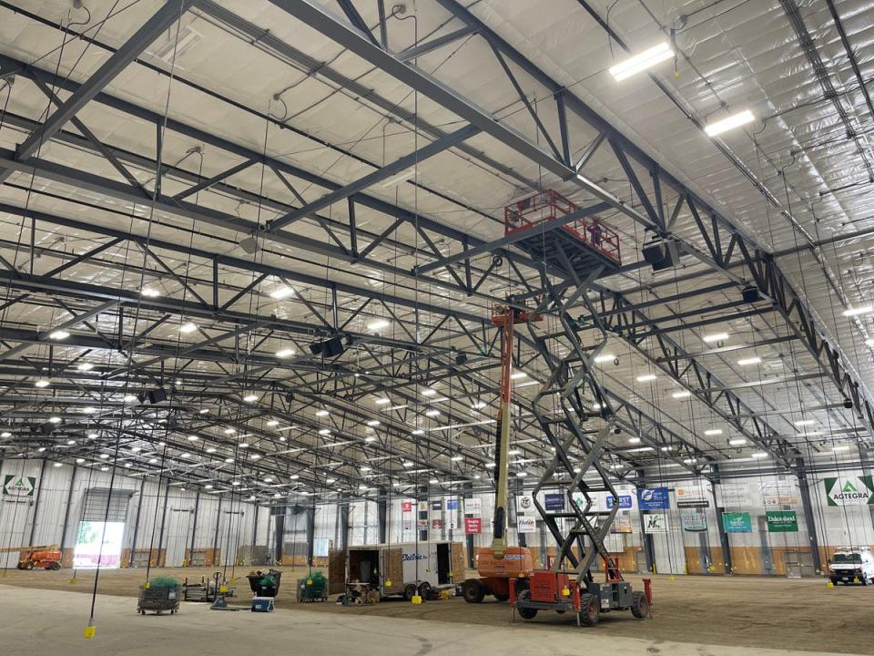 Electrical workers continue with finishing touches Aug. 11 at the Dakota Events Complex (DEX), a 150,000 square foot livestock and equestrian facility at the South Dakota State Fair in Huron.