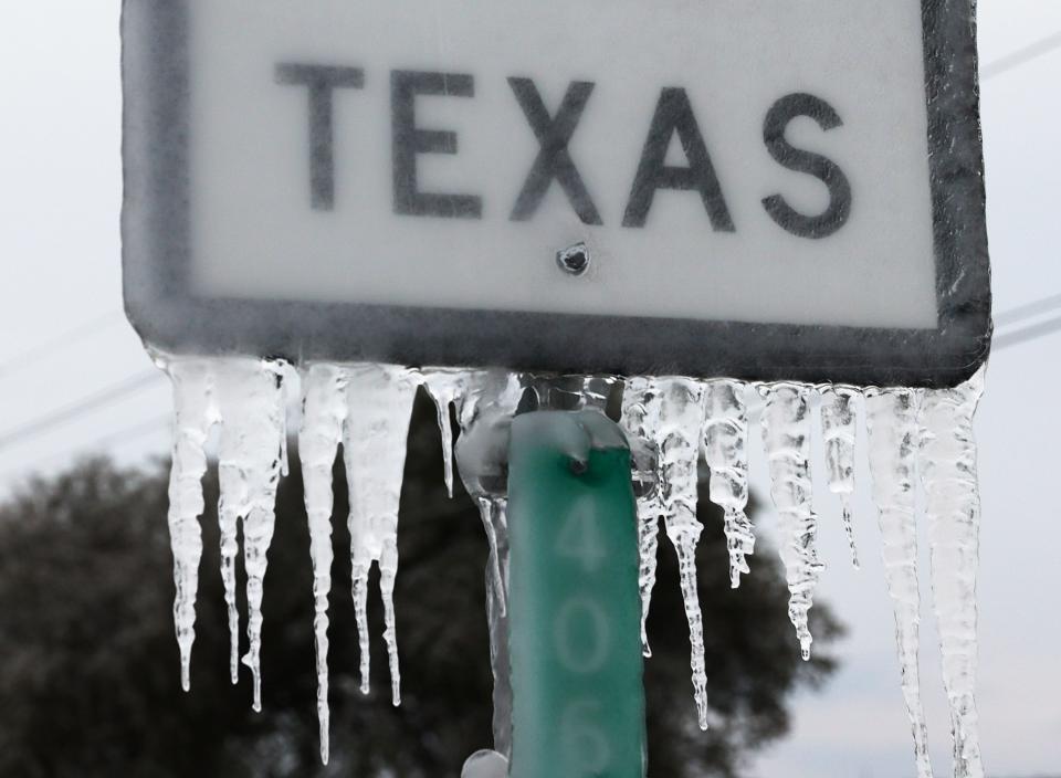 Icicles hang off the  State Highway 195 sign on Feb.18 in Killeen, Texas. Winter storm Uri brought historic cold weather and power outages to Texas.