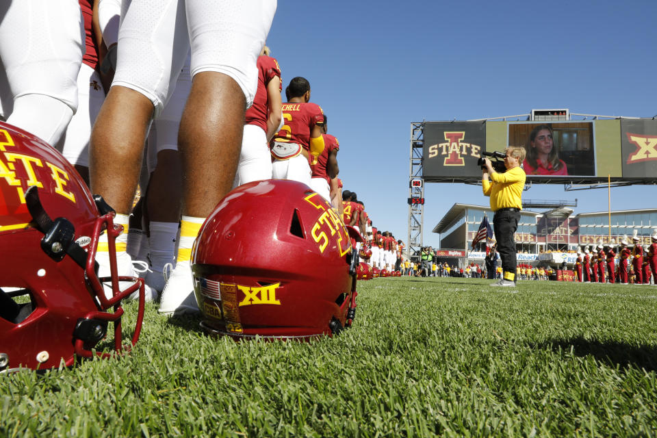 AMES, IA - SEPTEMBER 22: During a pre-game moment of silence the Iowa State Cyclones and the Akron Zips wear CBA helmet decals to honor Celia Barquin Arozamena, (pictured on the jumbotron), at Jack Trice Stadium on September 22, 2018 in Ames, Iowa. Celia Barquin Arozamena, Iowa States 2018 Big 12 Women's Golf Champion, was murdered Monday September 17th while playing golf on a course near the college. (Photo by David Purdy/Getty Images)