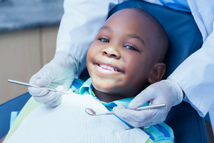 <span class="caption">A trip to the dentist doesn’t have to be scary.</span> <span class="attribution"><a class="link " href="https://www.shutterstock.com/image-photo/close-boy-having-his-teeth-examined-245845876" rel="nofollow noopener" target="_blank" data-ylk="slk:wavebreakmedia/Shutterstock;elm:context_link;itc:0;sec:content-canvas">wavebreakmedia/Shutterstock</a></span>