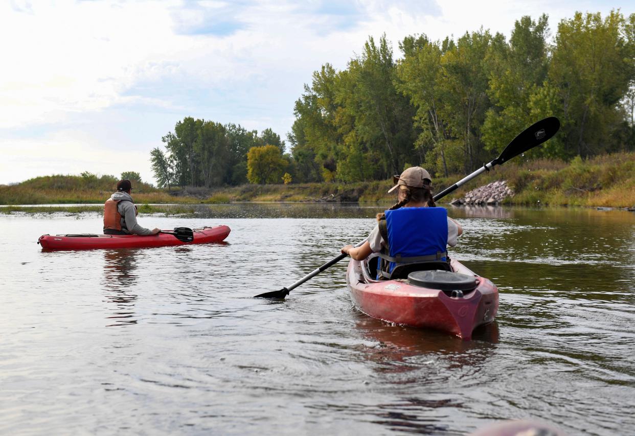 Alex Solem, upland game biologist with South Dakota Game, Fish and Parks, and intern Jessica Kading kayak while looking for evidence of river otters on Tuesday, September 28, 2021, on the Big Sioux River just south of Dell Rapids.