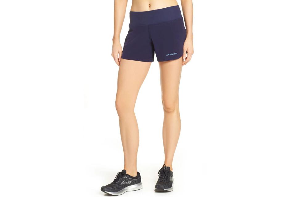 Woman wearing navy running shorts