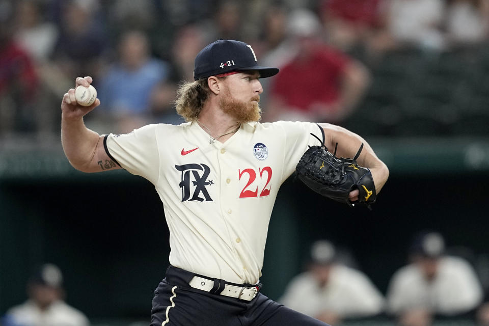 Texas Rangers starting pitcher Jon Gray throws to a Seattle Mariners batter during the first inning of a baseball game Friday, June 2, 2023, in Arlington, Texas. (AP Photo/Tony Gutierrez)