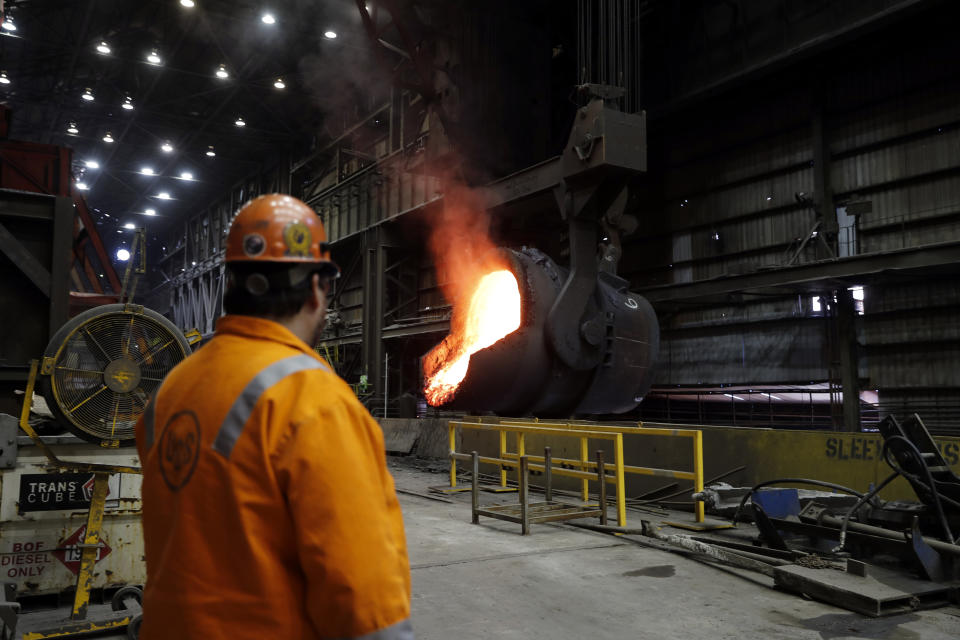 FILE - In this June 28, 2018 photo file, senior melt operator Randy Feltmeyer watches a giant ladle as it backs away after pouring its contents of red-hot iron into a vessel in the basic oxygen furnace as part of the process of producing steel at the U.S. Steel Granite City Works facility in Granite City, Ill. President Donald Trump’s decision last year to tax imported steel tested the limits of his legal authority, strained relations with key U.S. allies and imposed higher costs and uncertainty on much of American industry. But his 25% tariffs haven’t even done much for the companies they were supposed to help. (AP Photo/Jeff Roberson, File)