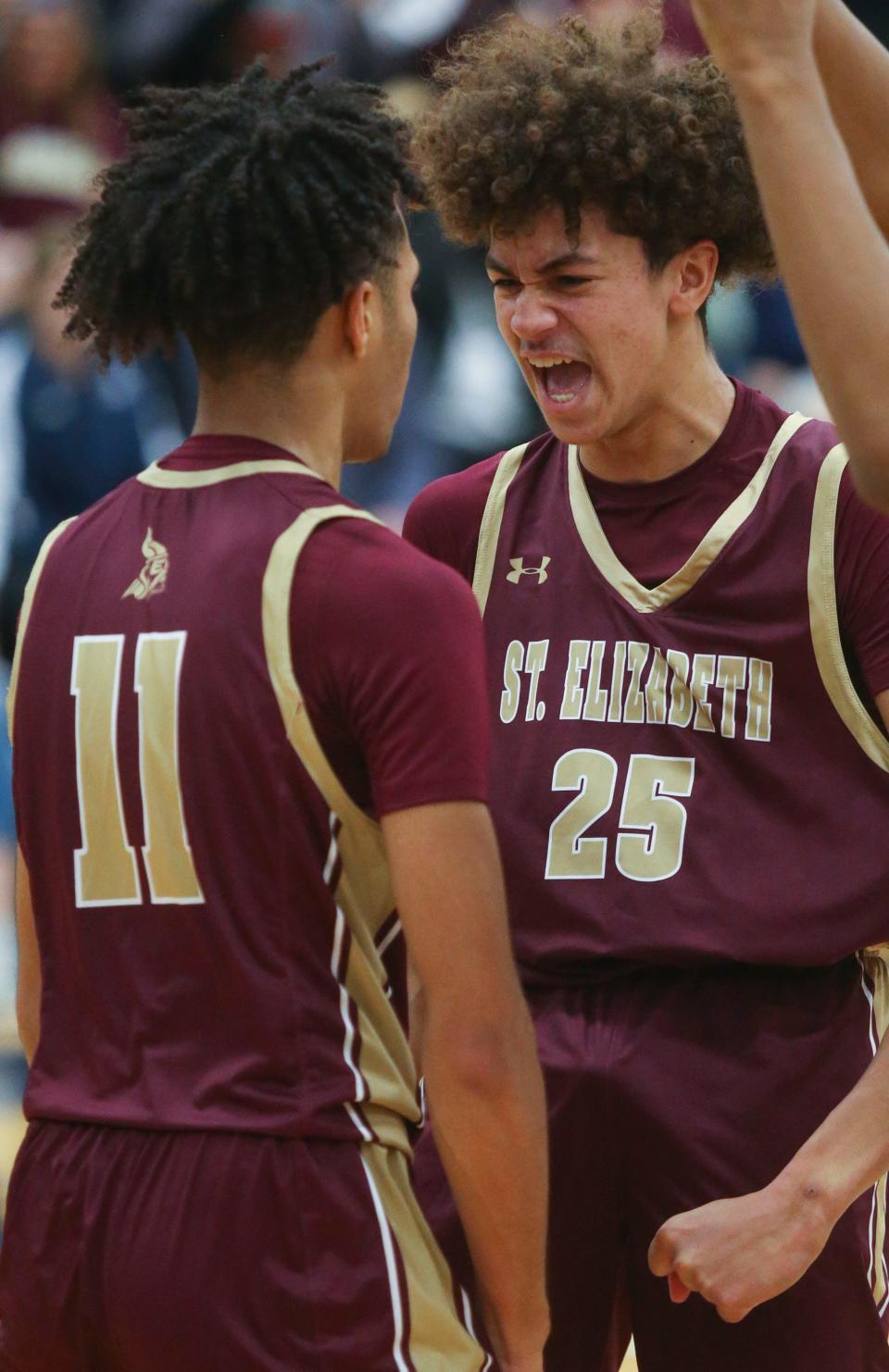 St. Elizabeth's Justin Lawrence (left) and Aiden Tobiason celebrate late in the second half of the Vikings' 54-45 win at Salesianum, Friday, Jan. 6, 2023.