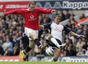 LONDON, ENGLAND - APRIL 17: Wayne Rooney of Manchester United clashes with Jermaine Jenas of Tottenham Hotspur during the Barclays Premiership match between Tottenham Hotspur and Manchester United at White Hart Lane on April 17 2006 in London, England. (Photo by Matthew Peters/Manchester United via Getty Images)