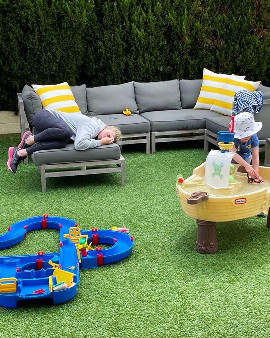 Tiffiny Hall sleeps on an outdoor sofa in her backyard