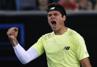 Canada's Milos Raonic celebrates after defeating Greece's Stefanos Tsitsipas in their third round singles match at the Australian Open tennis championship in Melbourne, Australia, Friday, Jan. 24, 2020. (AP Photo/Andy Wong)