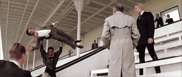 Grace Jones lifts a man over her head in this "James Bond" film