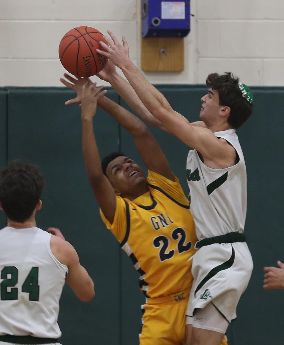From left, Greenburgh-North Castle's Daniel Garcia (22) and The Leffell School's Russell Wechsler (3) battle for a rebound during action at The Leffell School in Greenburgh Jan. 23, 2024. Leffell won the game 80-53.