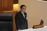 Thailand's Prime Minister Prayuth Chan-ocha delivers a speech during the special session at the parliament house in Bangkok, Thailand, Monday, Oct. 26, 2020. Thailand's Parliament began a special session Monday that was called to address tensions as pro-democracy protests draw students and other demonstrators into the streets almost daily demanding the prime minister's resignation. (AP Photo/Sakchai Lalit)