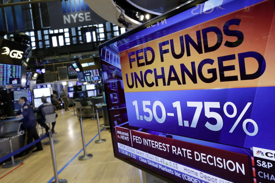 A screen on the floor of the New York Stock Exchange shows the rate decision of the Federal Reserve, Wednesday, May 2, 2018. The Federal Reserve is keeping its benchmark interest rate unchanged but says that inflation is climbing after years of being stuck below the Fed’s target level. (AP Photo/Richard Drew)