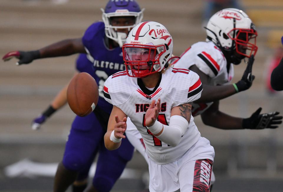 Jackson quarterback Jalen Sonnier pitches out to RB J'Nethen Jackson (8) against Fletcher in a September game. The Tigers recorded their first winning season since 2009.