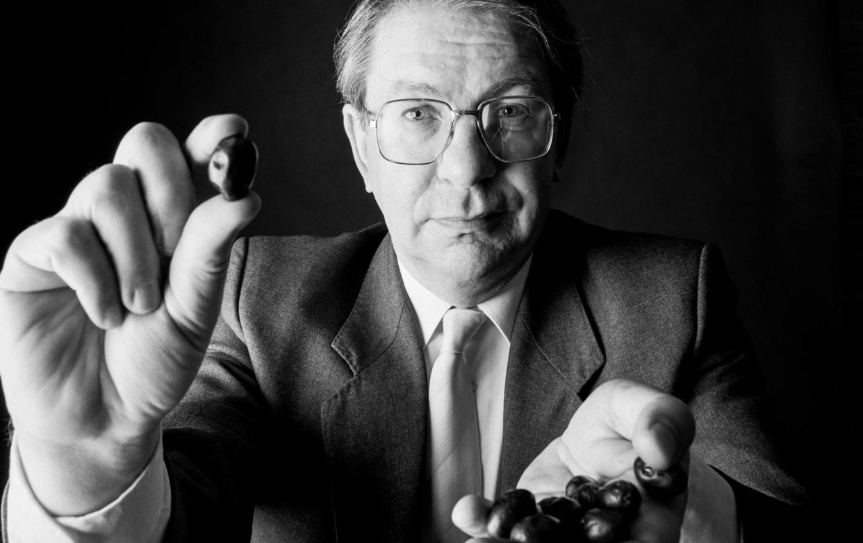 Professor Philip James, photographed in 1991, holding olives