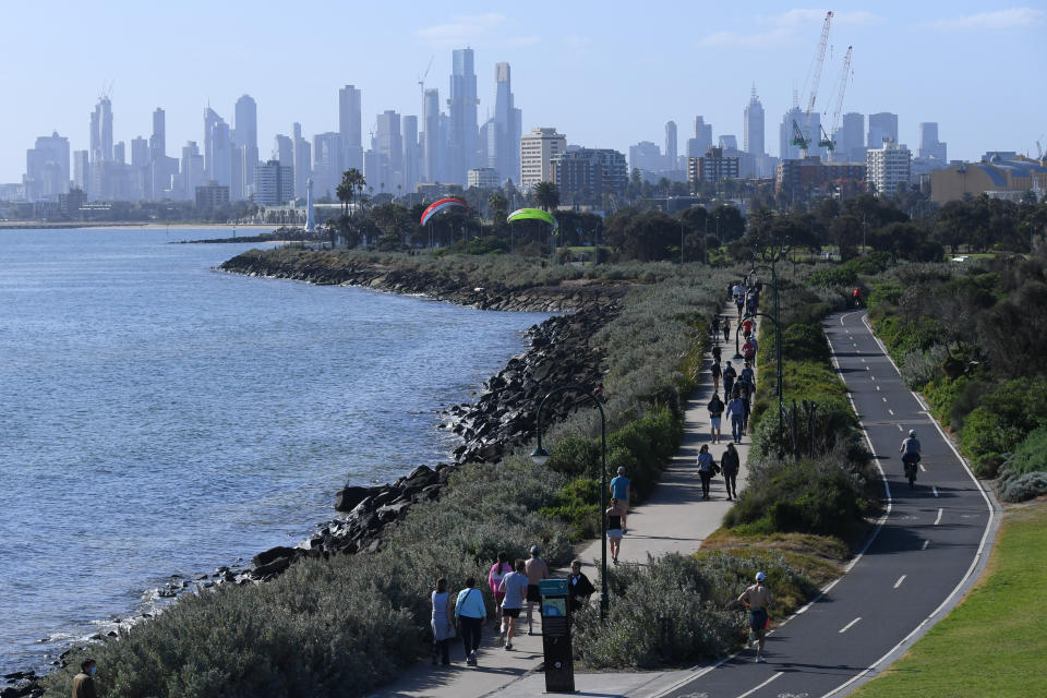 People are seen exercising and enjoying the sunshine in Melbourne during lockdown. Source: AAP