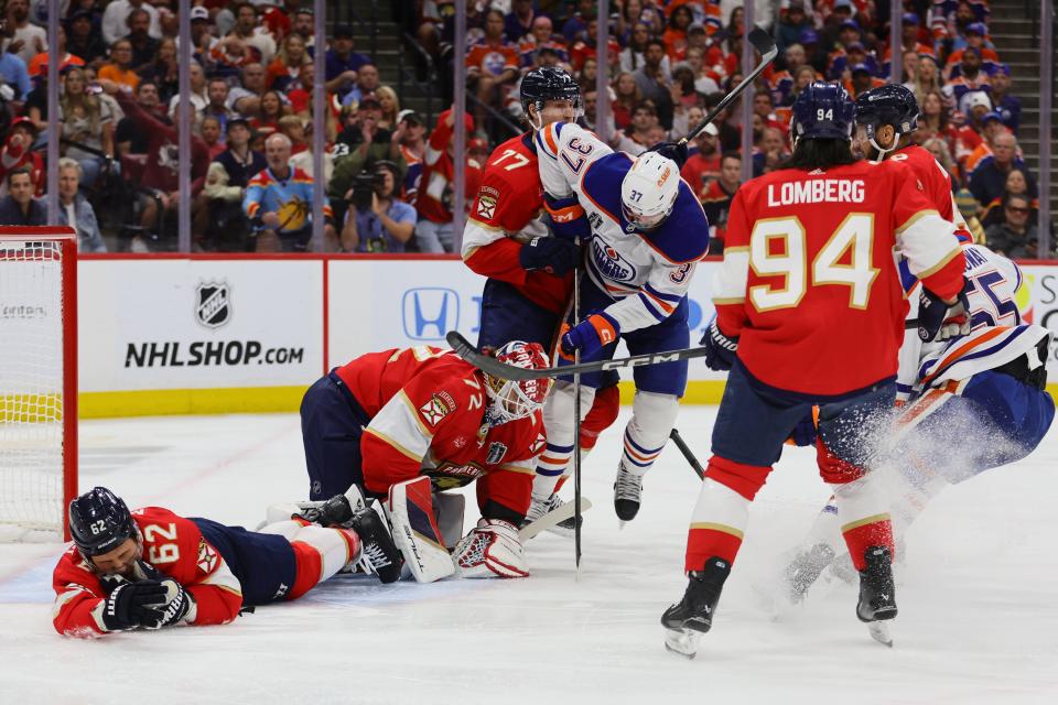 Jun 24, 2024; Sunrise, Florida, USA; 8Florida Panthers goaltender Sergei Bobrovsky (72) blocks a shot on net by Edmonton Oilers forward Warren Foegele (37) during the first period in game seven of the 2024 Stanley Cup Final at Amerant Bank Arena. Mandatory Credit: Sam Navarro-USA TODAY Sports