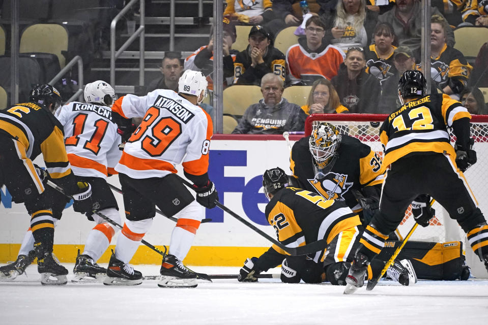 Philadelphia Flyers' Travis Konecny (11) gets a shot past Pittsburgh Penguins goaltender Tristan Jarry (35) for a goal during the second period of an NHL hockey game against the Pittsburgh Penguins in Pittsburgh, Thursday, Nov. 4, 2021. (AP Photo/Gene J. Puskar)