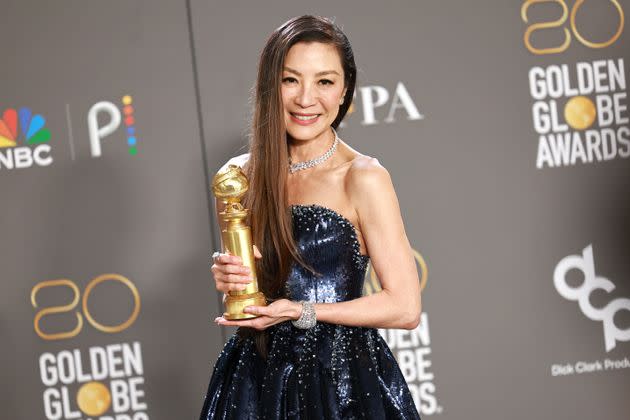 Yeoh poses in the press room with the award for Best Actress in a Motion Picture – Musical or Comedy for 