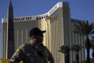 <p>A Las Vegas police officer stands by a blocked off area near the Mandalay Bay casino, Tuesday, Oct. 3, 2017, in Las Vegas. (Photo: John Locher/AP) </p>