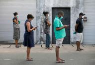 People maintain the one-meter distance in-between each other in Colombo