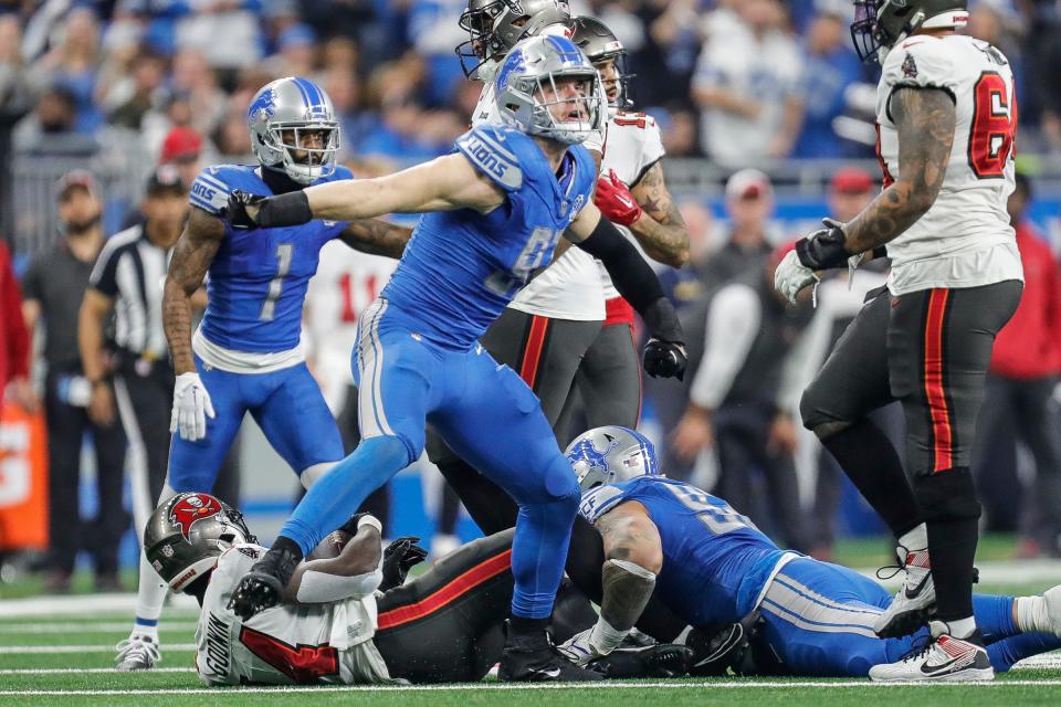 Detroit Lions defensive end Aidan Hutchinson (97) celebrates a play against Tampa Bay Buccaneers during the first half of the NFC divisional round at Ford Field in Detroit on Sunday, Jan. 21, 2024.
