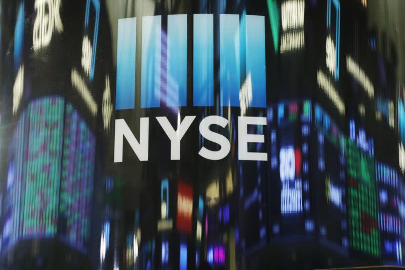 The day's numbers are reflected above the floor of the New York Stock Exchange shortly before the closing bell in New Yor