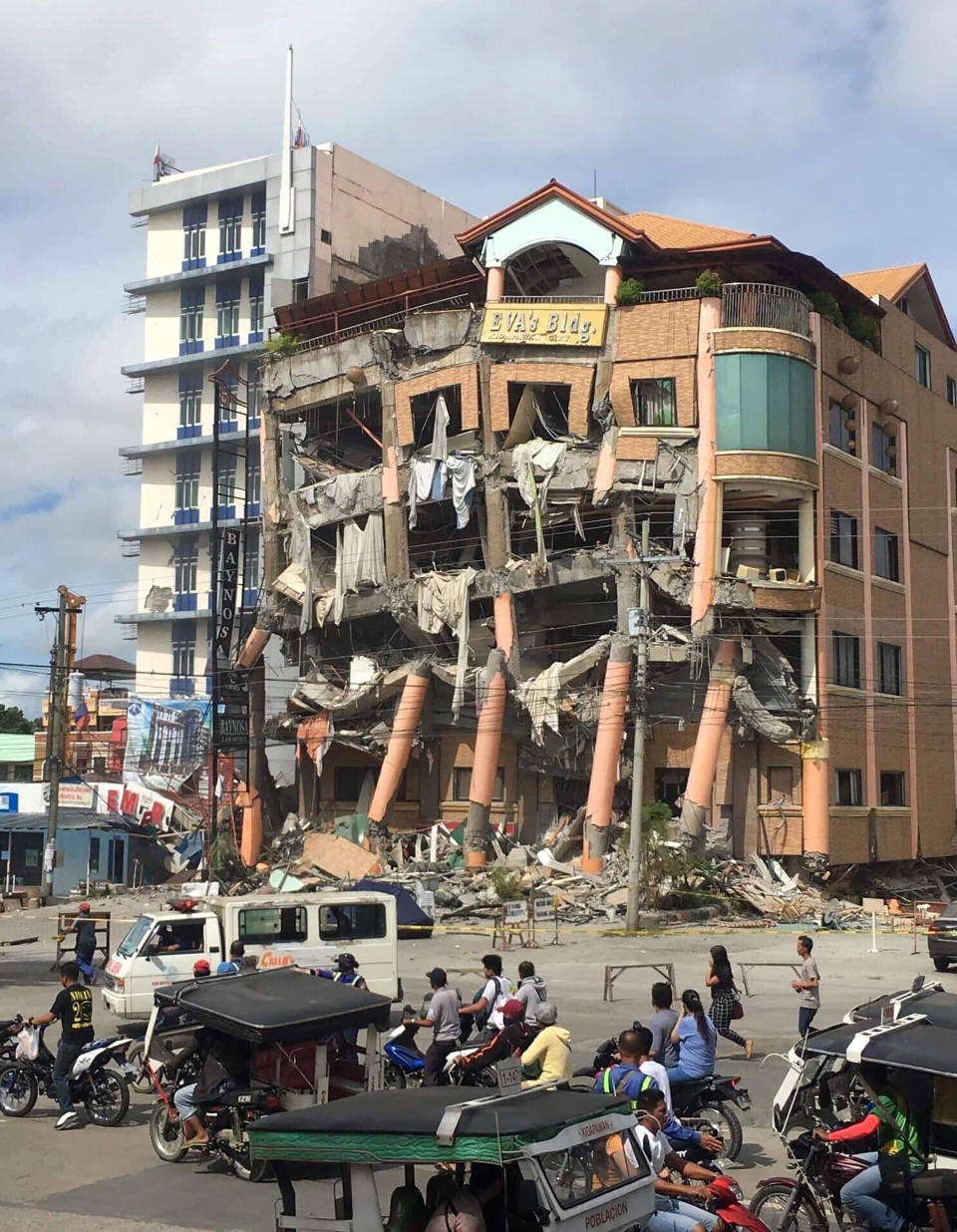 Eva's Hotel stands damaged after a strong earthquake in Kidapawan, north Cotabato province, Philippines, Thursday, Oct. 31, 2019. The third strong earthquake this month jolted the southern Philippines on Thursday morning, further damaging structures already weakened by the earlier shaking. (AP Photos/Williamor Magbanua)