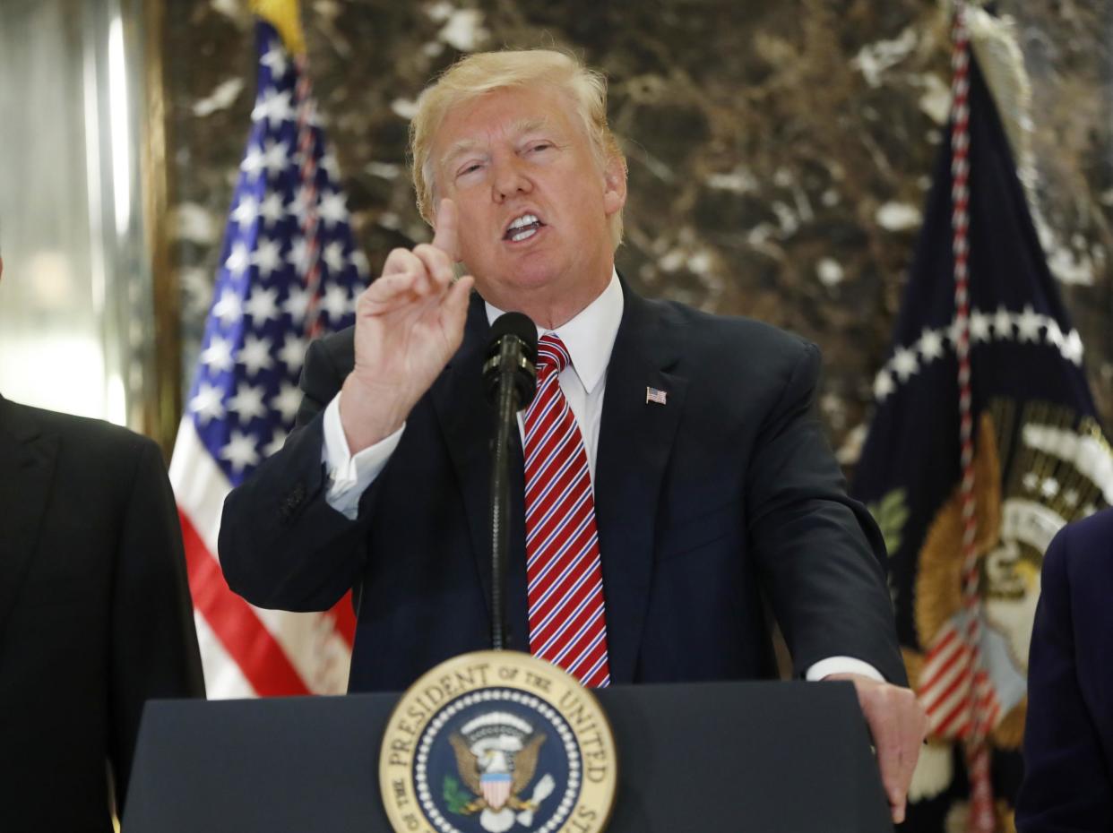 President Donald Trump speaks to the media in the lobby of Trump Tower in New York: AP Photo/Pablo Martinez Monsivais